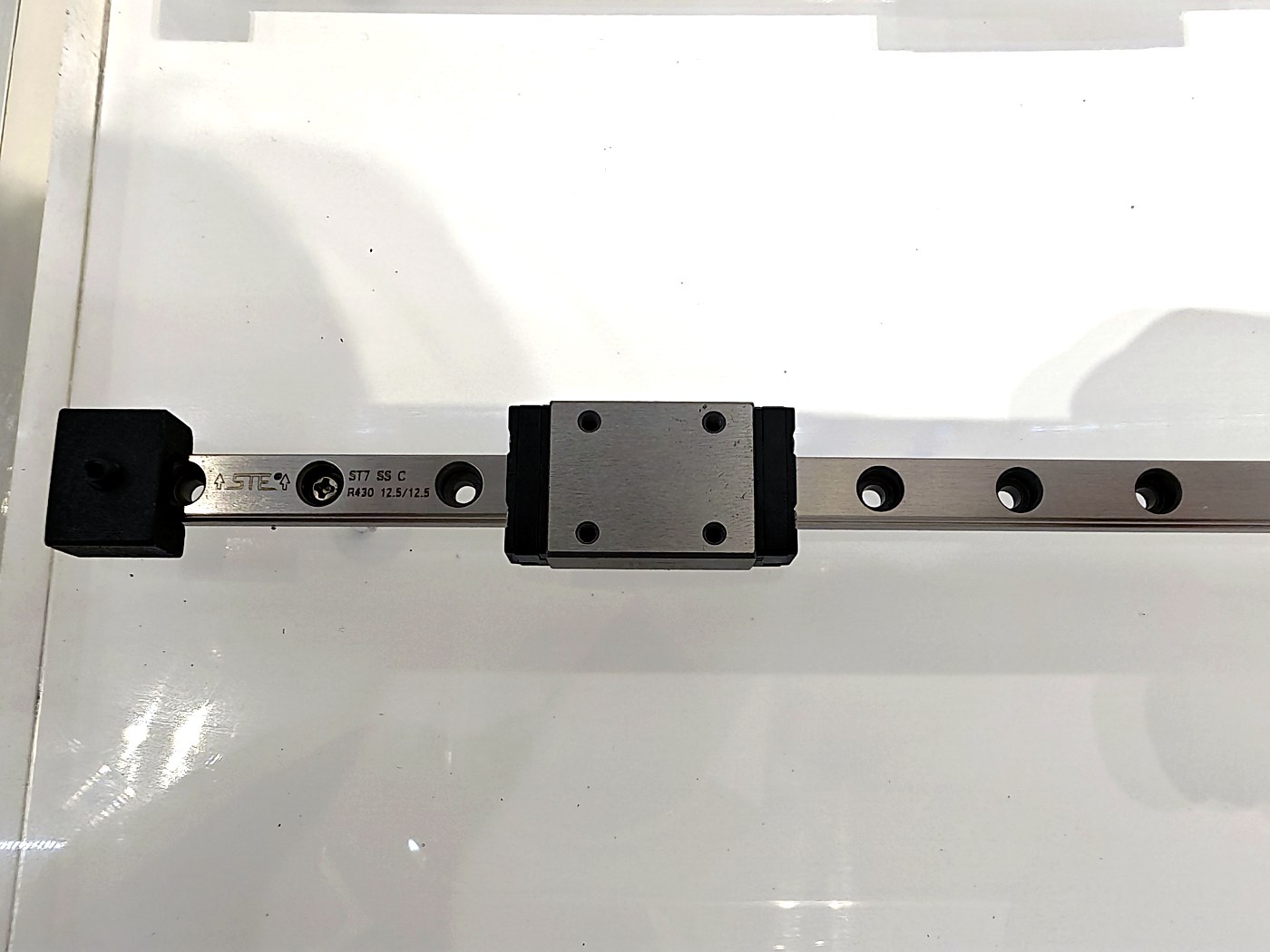 DDJ miniature linear rail with single carriage on white background