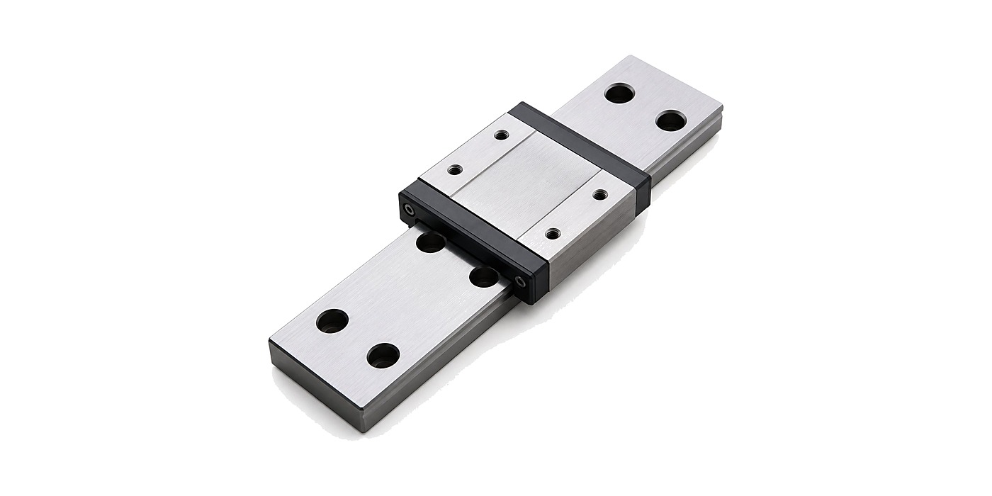 DDJ STW9 wide-type miniature linear guide with black end wiper seals on white background